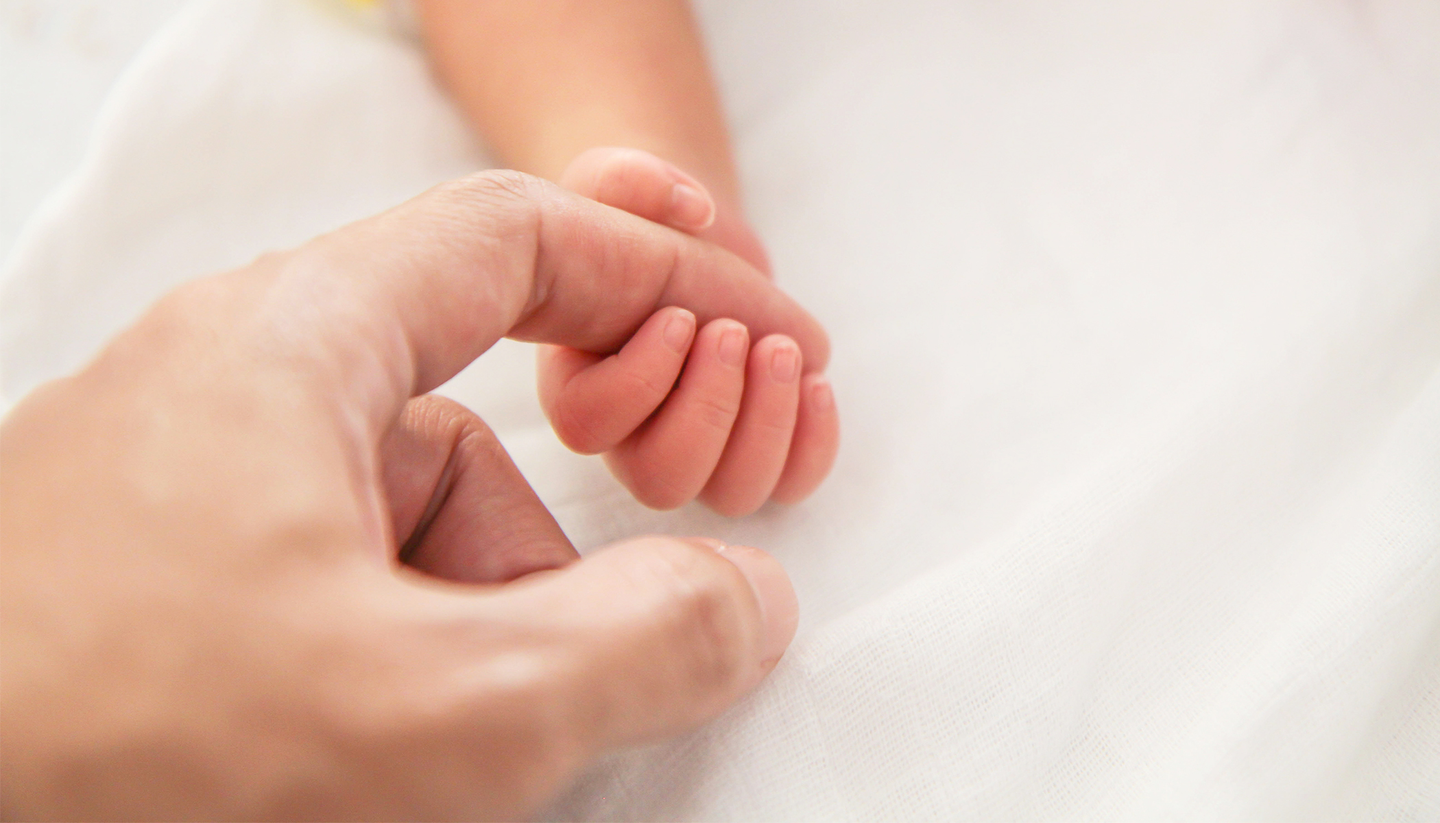 Photos of Grown Man With Down Syndrome Holding His Brother’s Baby for the First Time Go Viral