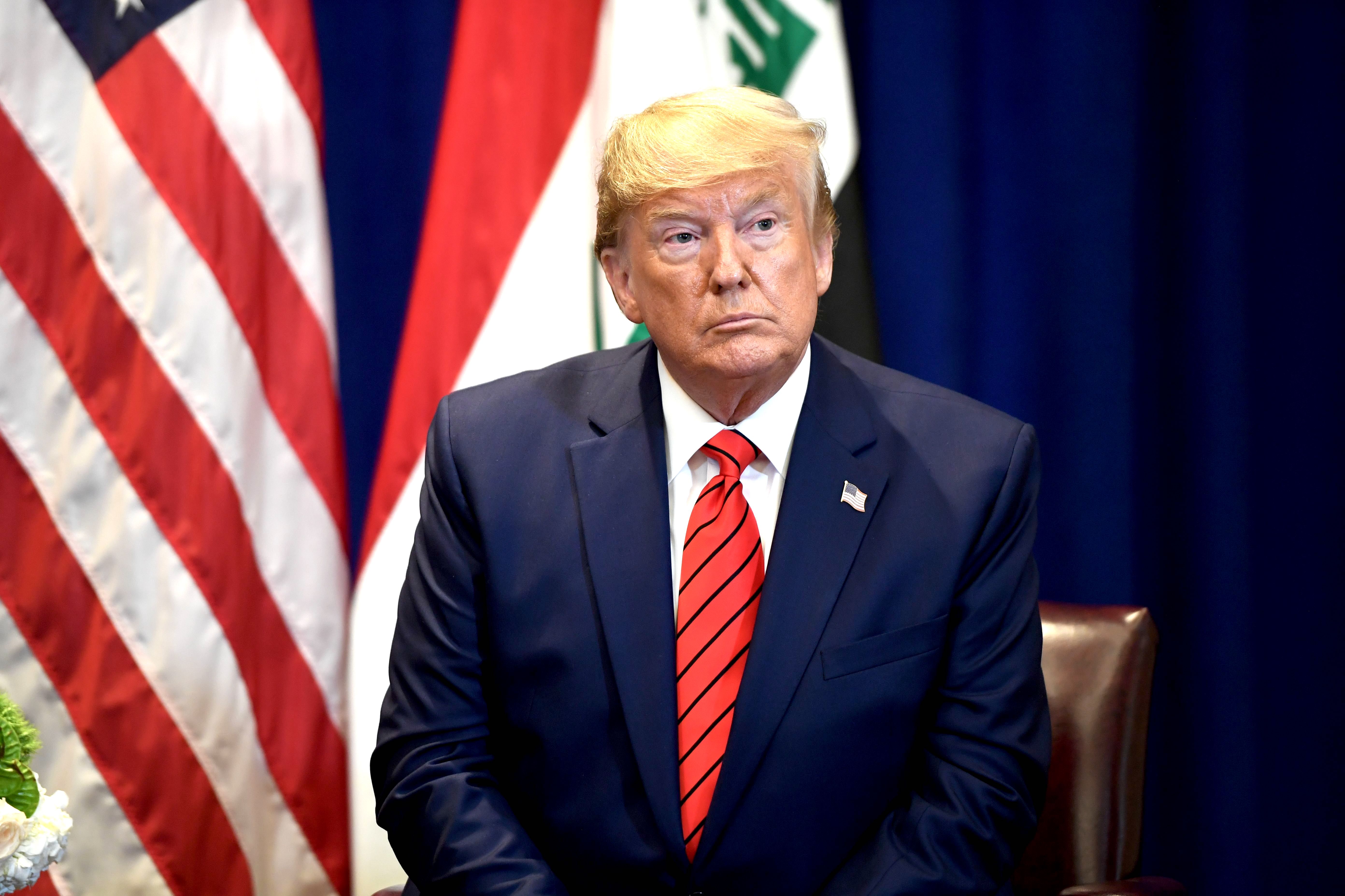 President Donald Trump attends a meeting