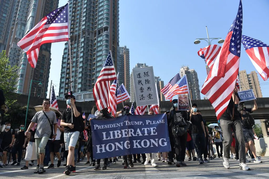 Protesters with US national flags take part in a pro-democracy march in Hong Kong's Tuen Mun district on Sept. 21, 2019. (Nicolas Asfouri /AFP/Getty Images)