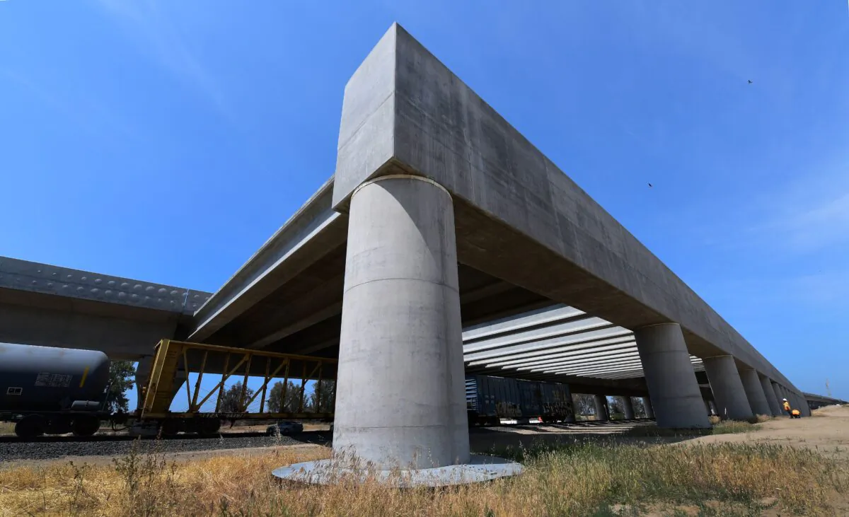A Union Pacific train runs beneath the high-speed railway tracks at the Pergola in Fresno, California, on May 8, 2019, amid ongoing construction of the railway in California's Central and San Joaquin Valleys. (Frederic J. Brown/AFP/Getty Images)