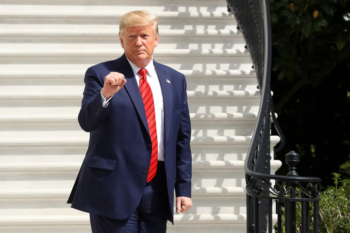 President Donald Trump gestures as he returns to the White House after attending the United Nations General Assembly on Sept. 26, 2019. (Mark Wilson/Getty Images)