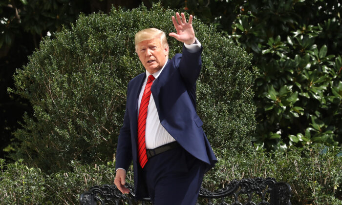 President Donald Trump waves as he returns to the White House after attending the United Nations General Assembly on Sept. 26, 2019. (Mark Wilson/Getty Images)