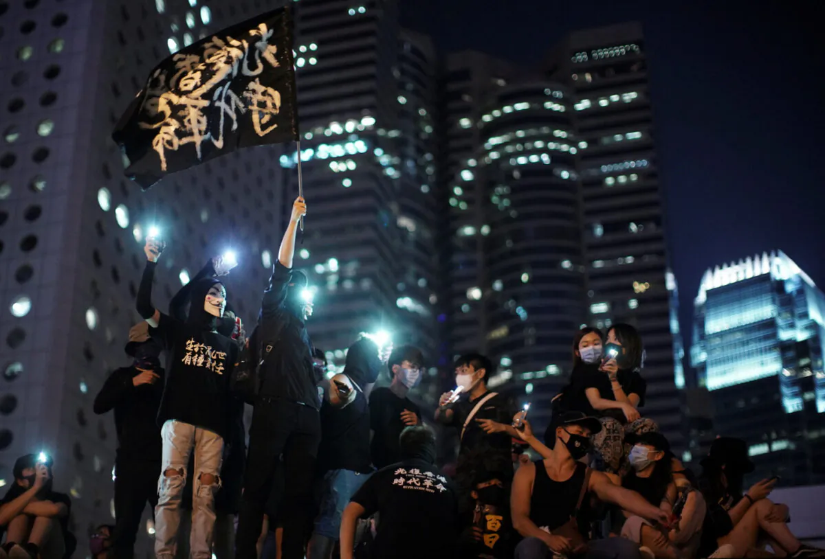 Anti-government protesters attend a rally at Edinburgh Place to show solidarity for arrested political activists being held at San Uk Ling detention center in Hong Kong, China on Sept. 27, 2019. (Athit Perawongmetha/Reuters)