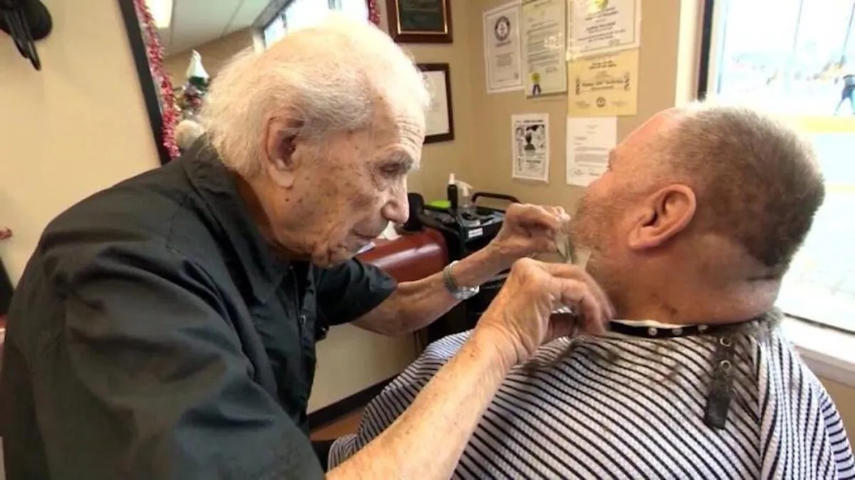 Anthony Mancinelli trims a customer's beard in Fantastic Cuts in New Windsor, New York. (CNN)