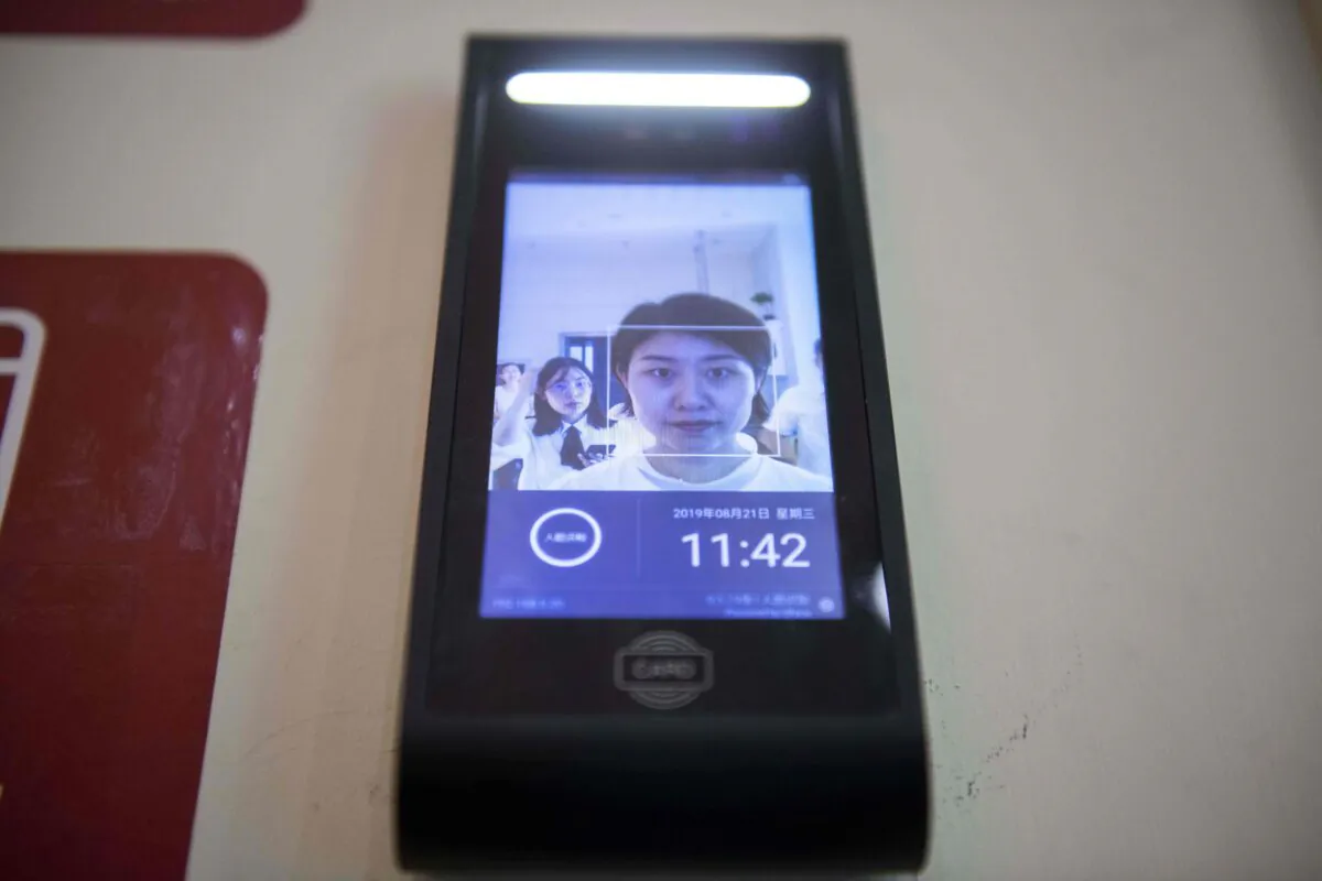 A woman uses a facial recognition device installed at a self-service supermarket in Tianjin, China on Aug. 21, 2019. (Nicolas Asfouri/AFP/Getty Images)
