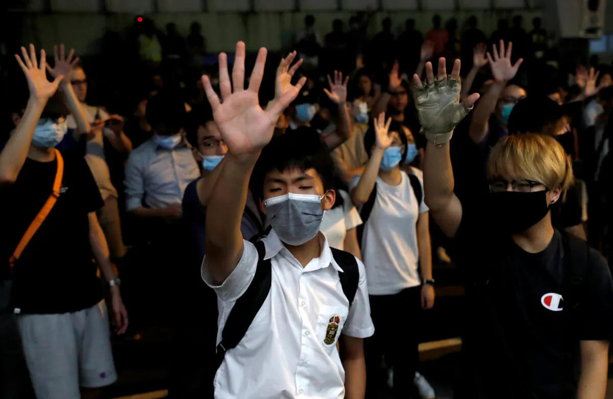 Protesters gather outside the venue of first community dialogue held by Hong Kong Chief Executive Carrie Lam in Hong Kong, China on Sept. 26, 2019. (Tyrone Siu/Reuters)
