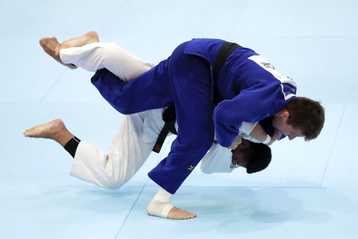 Jack Hatton (blue) of the United States and Marco Tumampad (white) of the Philippines compete in the Men's -81kg Pool C first round on day four of the World Judo Championships at the Nippon Budokan in Tokyo, Japan on Aug. 28, 2019. (Kiyoshi Ota/Getty Images)
