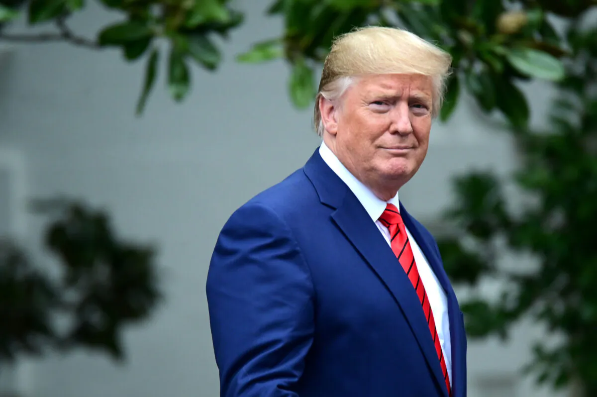 President Donald Trump arrives for a photo opportunity with sheriffs from across the country on the South Lawn of the White House in Washington on Sept. 26, 2019. (Reuters/Erin Scott)