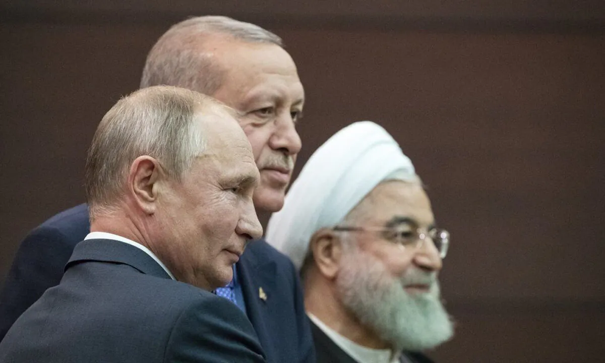 Russian President Vladimir Putin (L), Turkish President Recep Tayyip Erdogan and Iranian President Hassan Rouhani (R) pose for a picture after a news conference during their meeting in Ankara, Turkey, on Sept. 16, 2019. (Pavel Golovkin/AP Photo)