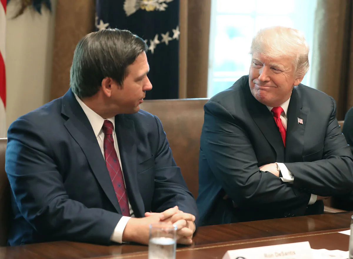 Florida Governor-elect Ron DeSantis (R) sits next to President Donald Trump during a meeting with Governor elects in the Cabinet Room at the White House on Dec. 13, 2018. (Mark Wilson/Getty Images)
