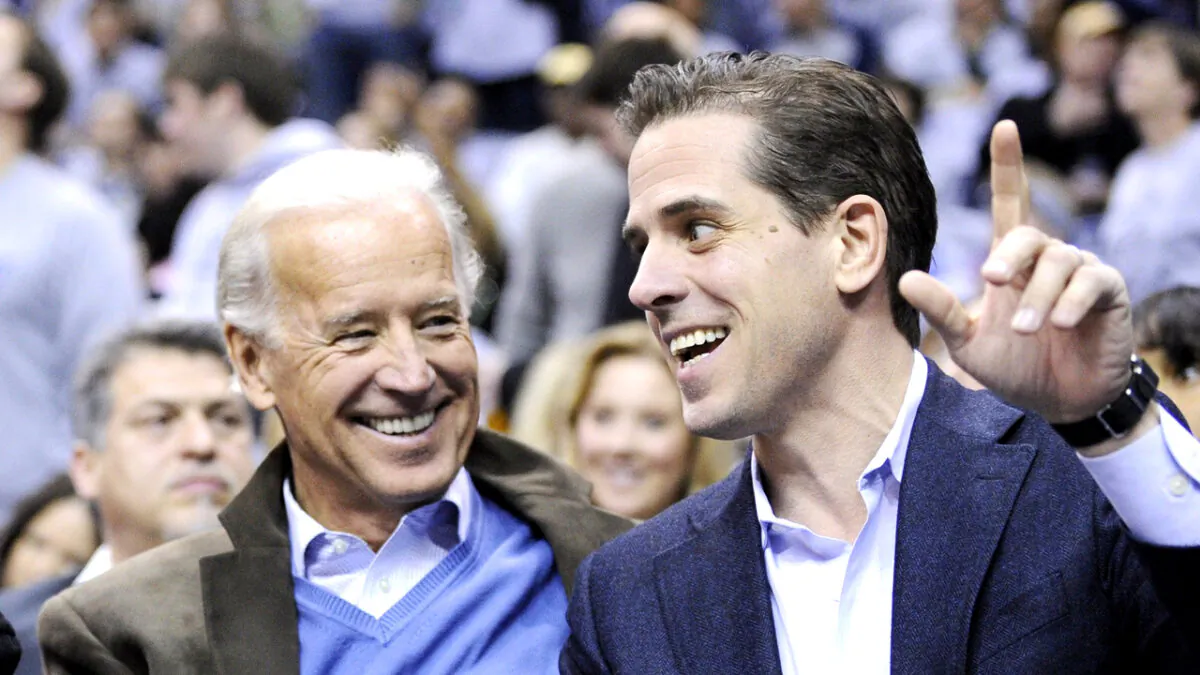 Former Vice President Joe Biden (L) and his son Hunter Biden at the Duke Georgetown NCAA college basketball game in Washington on Jan. 30, 2010. (Nick Wass/AP Photo)