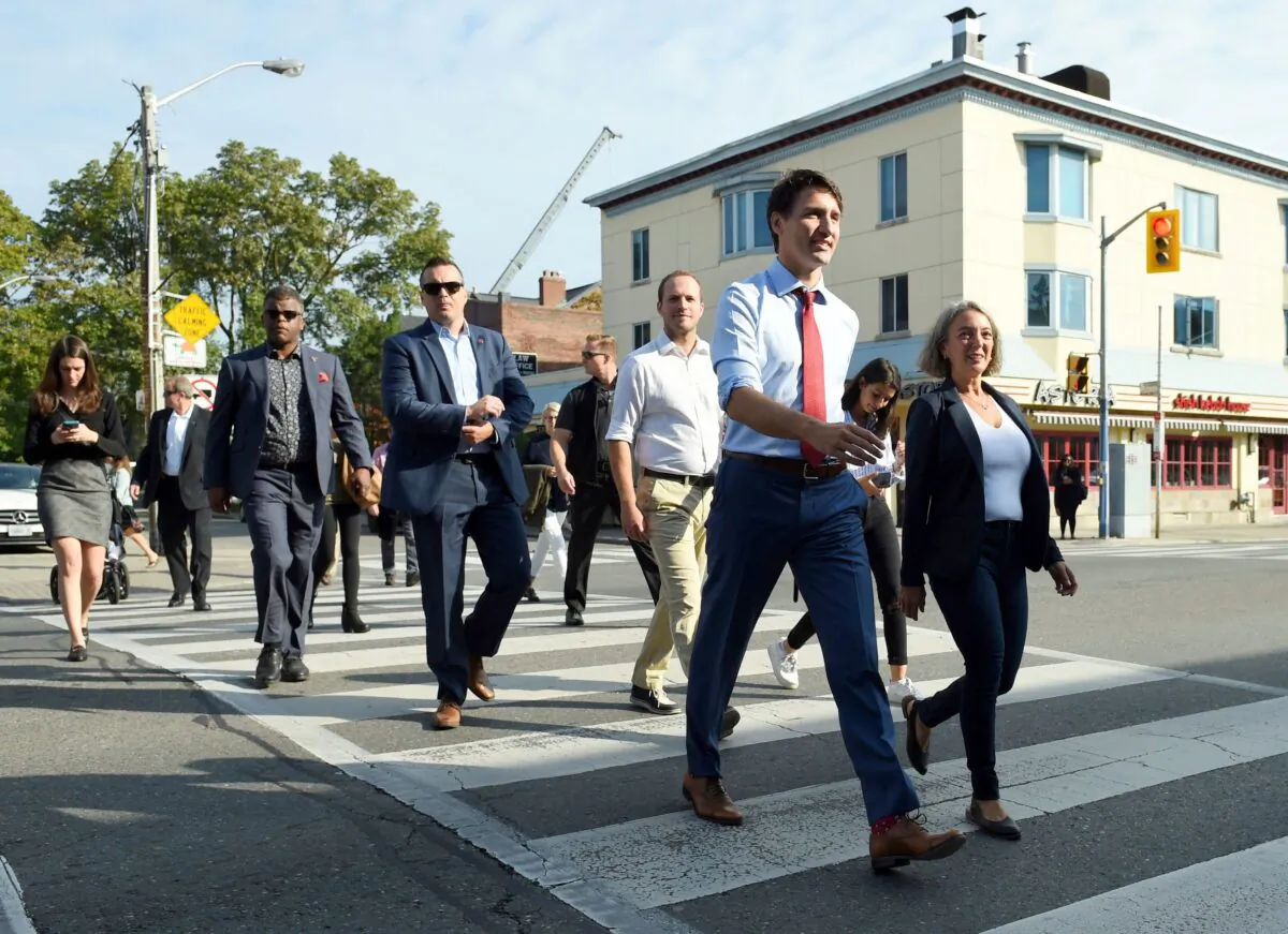 Liberal Leader Justin Trudeau crosses a street on his way to make a policy announcement in Toronto on Sept. 20, 2019. (THE CANADIAN PRESS/Sean Kilpatrick)