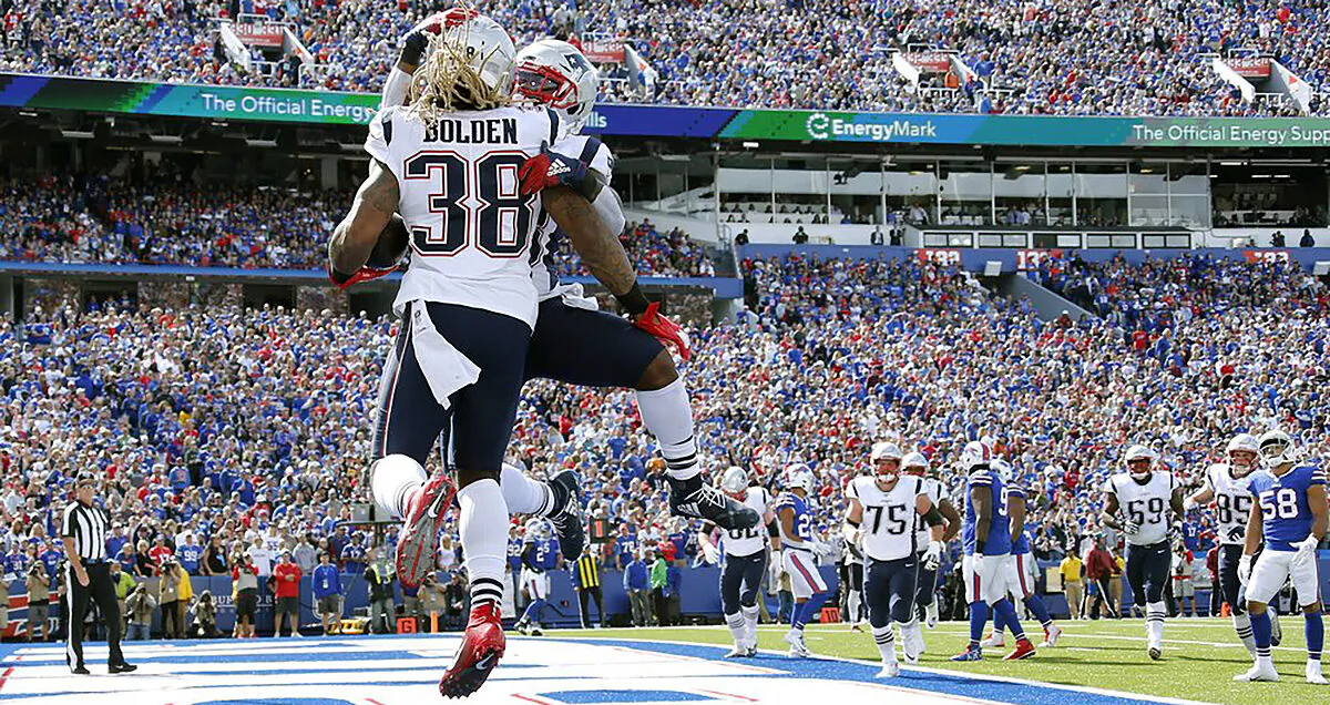 New England Patriots Running Back Brandon Bolden (L) celebrates his touchdown run against the Buffalo Bills at New Era Field in Orchard Park, N.Y., on Sept. 29, 2019. (AP Photo/Ron Schwane)