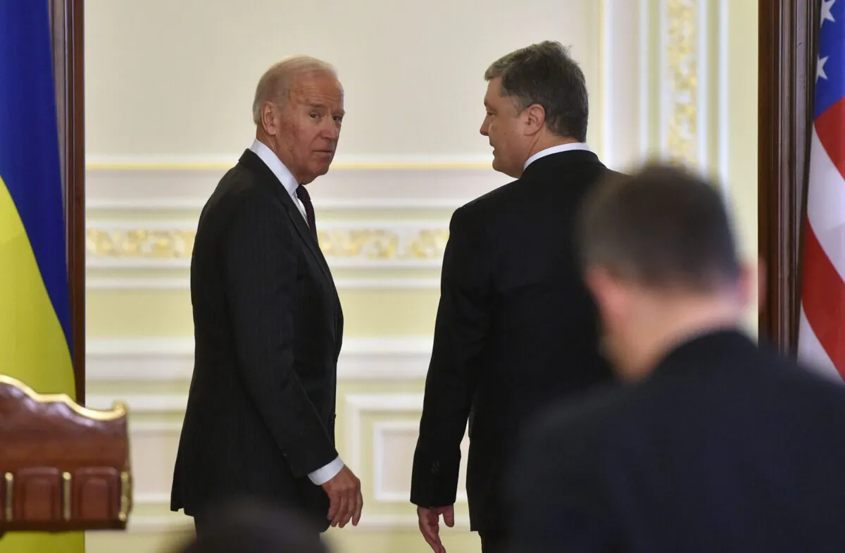US Vice President Joe Biden (L) and Ukrainian President Petro Poroshenko (R) leave at the end of their joint press statement following their meeting in Kiev on January 16, 2017.
Outgoing US Vice President Joe Biden meets Ukrainian leaders on 25th anniversary of Washington-Kiev diplomatic ties, amid questions over incoming Trump administration's impact on Ukraine conflict. / AFP / Genya SAVILOV (Photo credit should read GENYA SAVILOV/AFP/Getty Images)