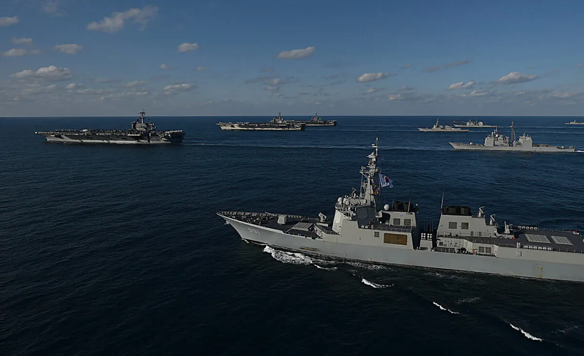In this handout image released Sept. 13, 2019, by South Korean Defense Ministry, USS Nimitz (3rd L), USS Ronald Reagan (2nd L), and USS Theodore Roosevelt (L) conduct operations with South Korea's destroyers during a joint naval drill in East Sea, South Korea, on Nov. 12, 2017. (South Korean Defense Ministry via Getty Images)