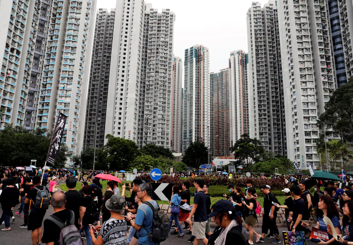 Anti-extradition bill protesters march at Tseung Kwan O residential district in Hong Kong, China on Aug. 4, 2019. (Tyrone Siu/Reuters)