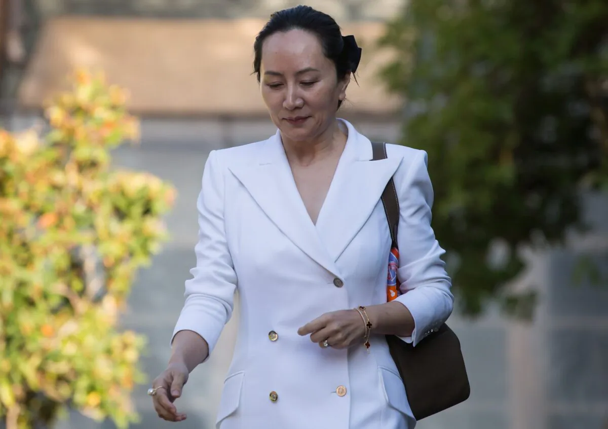 Huawei CFO Meng Wanzhou, who is out on bail and remains under partial house arrest after she was detained last year at the behest of American authorities, leaves her home to attend a court hearing in Vancouver on Sept. 30, 2019. (THE CANADIAN PRESS/Darryl Dyck)