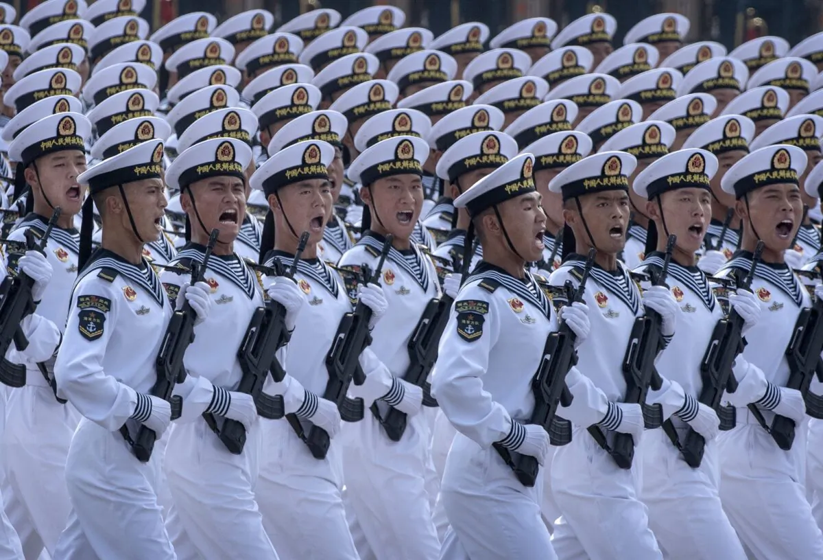 Chinese navy sailors march in formation during a parade to celebrate the 70th Anniversary of the founding of the Chinese communist regime at Tiananmen Square in 1949 in Beijing, China on October 1, 2019. (Kevin Frayer/Getty Images)