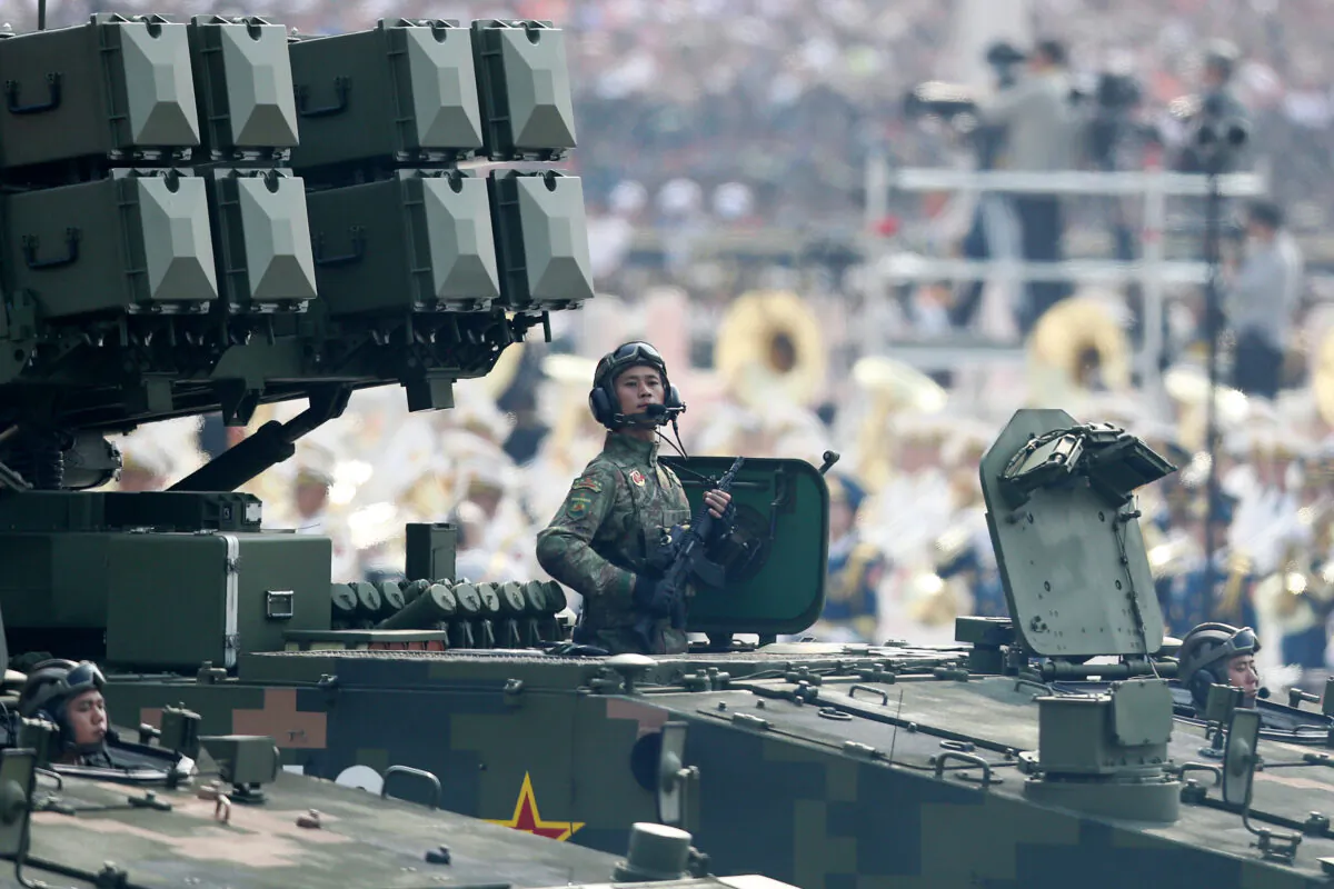 A soldier of the People's Liberation Army stands on a tank during a parade to celebrate the 70th Anniversary of the Communist Party's takeover of China, at Tiananmen Square in Beijing on Oct. 1, 2019. (Andrea Verdelli/Getty Images)