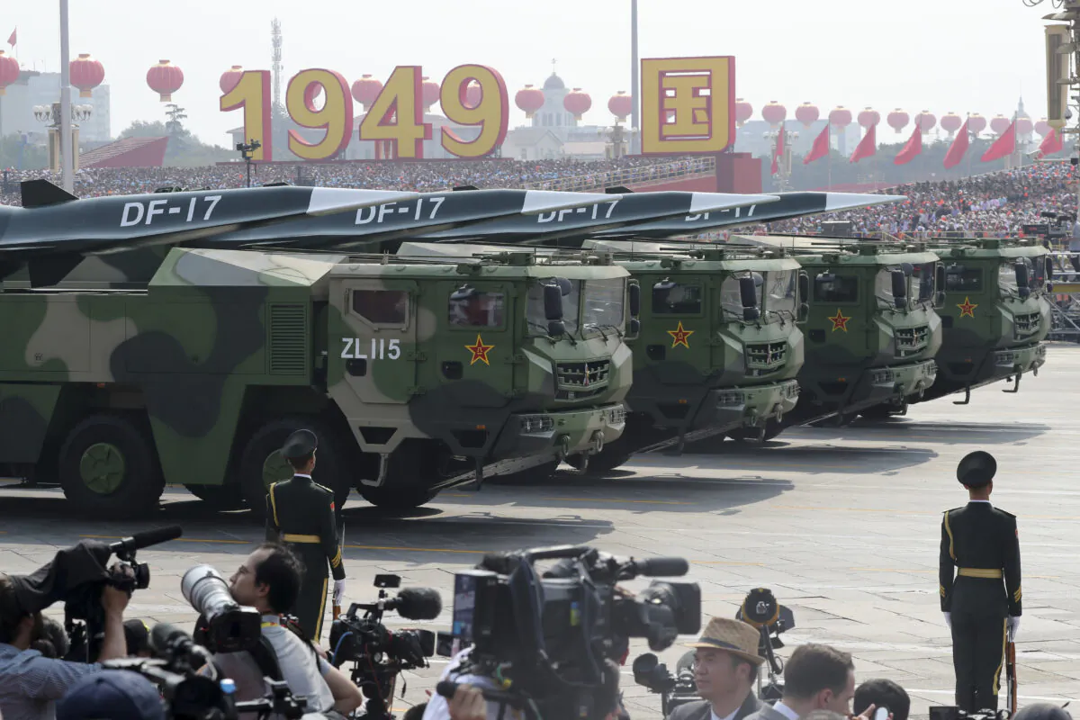 Military vehicles, carrying DF-17 missiles, roll in a parade as the PLA commemorate the 70th anniversary of the founding of the Communist dictatorship in China in Beijing on Oct. 1, 2019. The Chinese Communist Party's military has shown off a new hypersonic ballistic nuclear missile believed capable of breaching all existing anti-missile shields deployed by the United States and its allies. (Ng Han Guan/AP Photo)