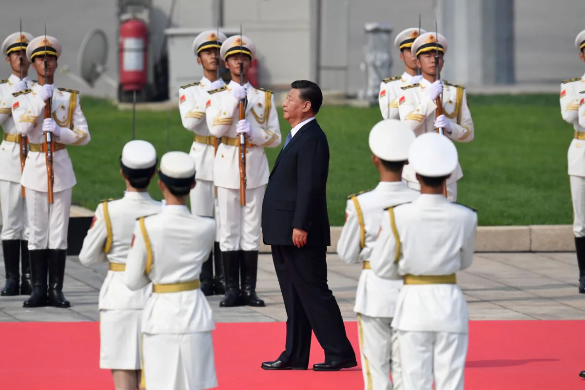 Chinese leader Xi Jinping (C) walks towards the Monument to the People's Heroes at Tiananmen Square during a wreath-laying ceremony marking Martyrs' Day in Beijing on Sept. 30, 2019. (Madoka Ikegami/AFP/Getty Images)