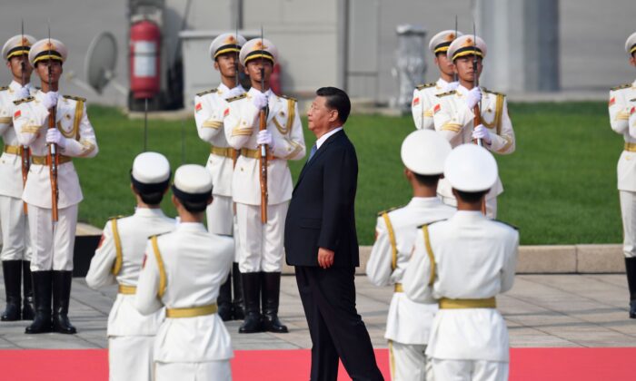 Chinese leader Xi Jinping (C) walks towards the Monument to the People's Heroes at Tiananmen Square during a wreath-laying ceremony marking Martyrs' Day in Beijing on Sept. 30, 2019. (Madoka Ikegami/AFP/Getty Images)