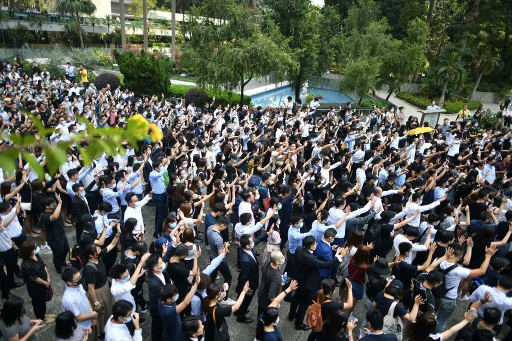 Protesters hold up hands to signify their five demands during a flash mob gathering at Chater Garden in Hong Kong on Oct. 2, 2019. (Mohd Rasfan/AFP via Getty Images)