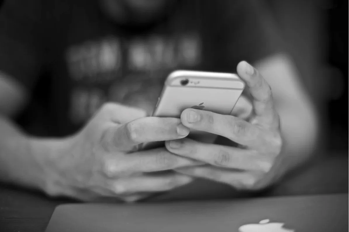 Stock photo showing someone using a smartphone. (Marjan Grabowski/Unsplash)