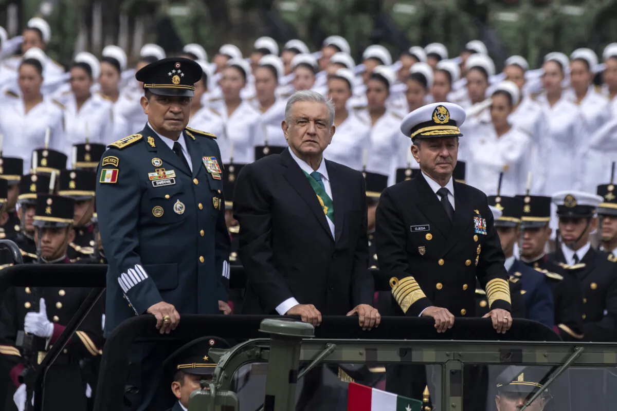 Mexican President Andres Manuel Lopez Obrador (C), Mexican Navy Secretary Jose Rafael Ojeda Duran (R) and Mexican Defence Secretary General Luis Cresencio Sandoval, take part in a parade celebrating a new anniversary of the country's independence, at the Zocalo Square in Mexico City on September 16, 2019. (Photo by PEDRO PARDO / AFP)        (Photo credit should read PEDRO PARDO/AFP/Getty Images)