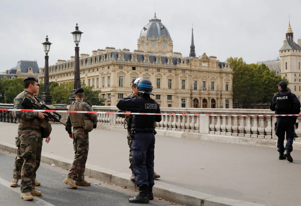 French police secure the area in front of the Paris Police headquarters in Paris, France on Oct. 3, 2019. (Philippe Wojazer/Reuters)