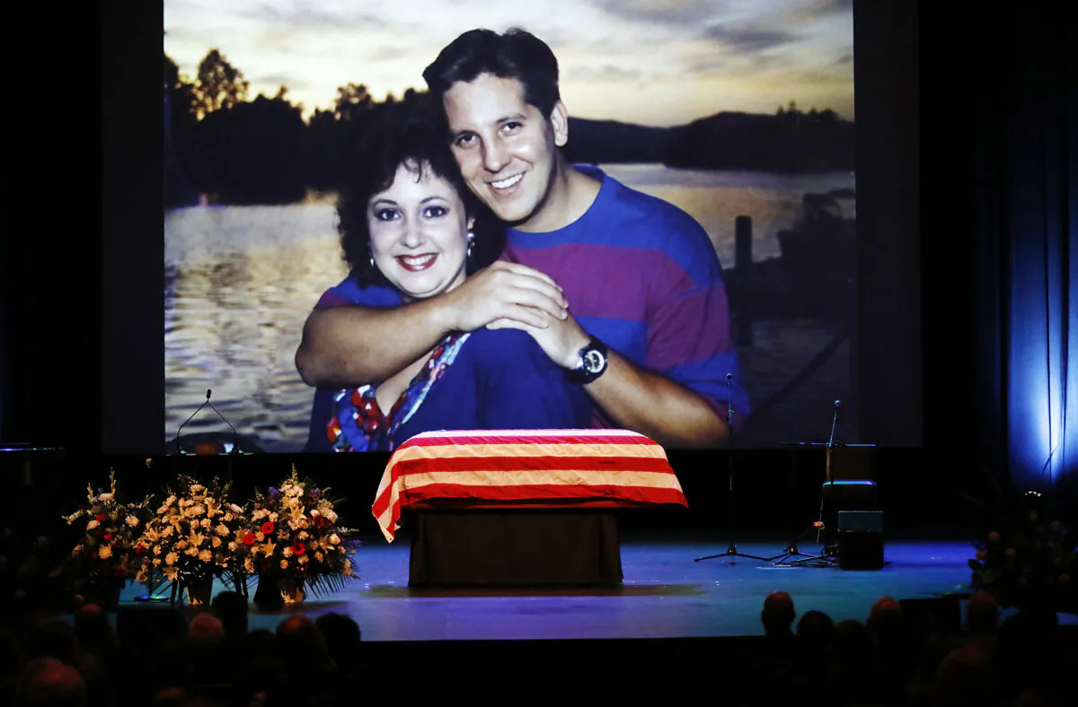 An image of Ventura County Sheriff Sgt. Ron Helus with his wife Karen is displayed during a memorial service in Westlake Village, California, on Nov. 15, 2018. (Al Seib-Pool/Getty Images)
