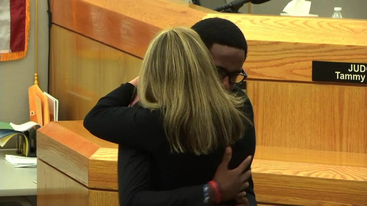 Brandt Jean stepped down from the witness stand and hugged Amber Guyger tightly on Wednesday. He said he didn't want her to go to prison, and that he forgave her.