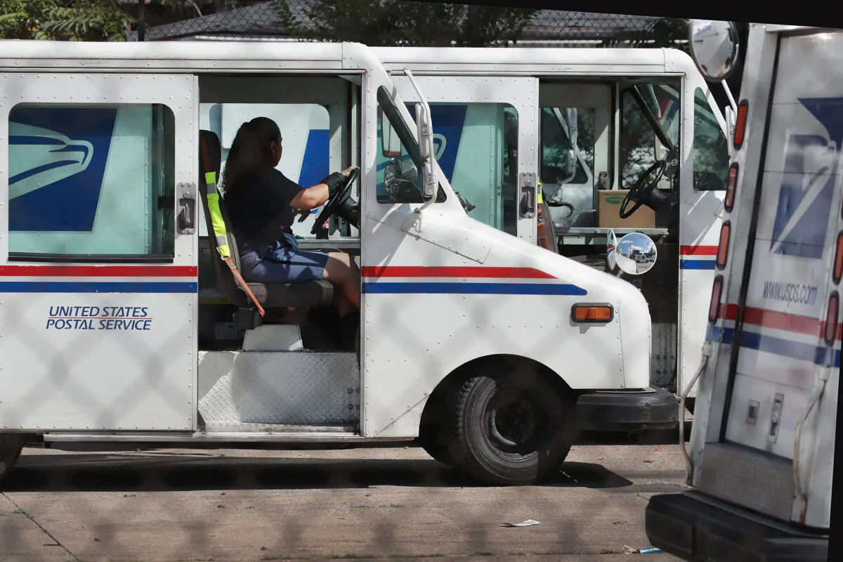 A United States Postal Service worker leaves a postal facility in Chicago, Illinois, on Aug. 15, 2019. (Scott Olson/Getty Images)