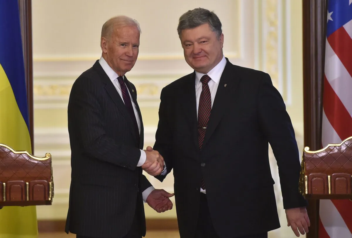 Vice President Joe Biden (L) and Ukrainian President Petro Poroshenko shake hands at the end of their joint press statement following their meeting in Kiev on Jan. 16, 2017. (Genya Savilov/AFP/Getty Images)