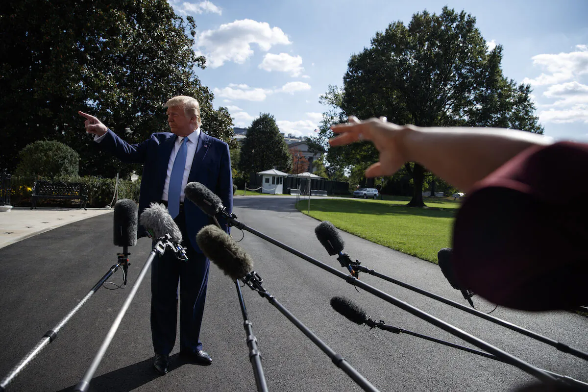 President Donald Trump talks to reporters on the South Lawn of the White House, Friday, Oct. 4, 2019, in Washington. (AP Photo/Evan Vucci)