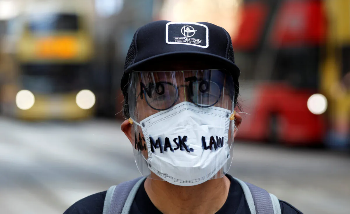 An anti-government protester wearing a mask attends a lunch time protest, after local media reported on an expected ban on face masks under emergency law, at Central, in Hong Kong on Oct. 4, 2019. (Tyrone Siu/Reuters)