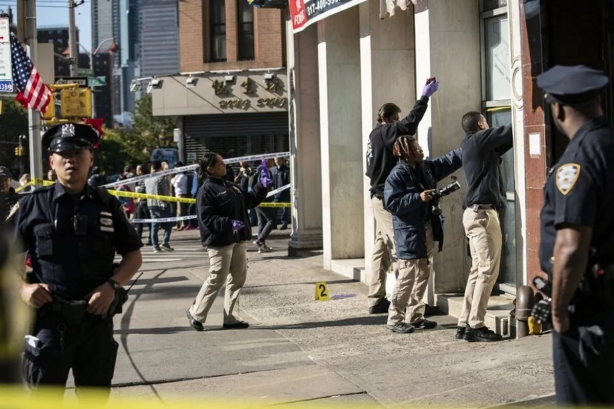 New York Police guard the scene of the brutal attacks in Chinatown where 4 homeless men were killed. (AP Photo/Jeenah Moon)