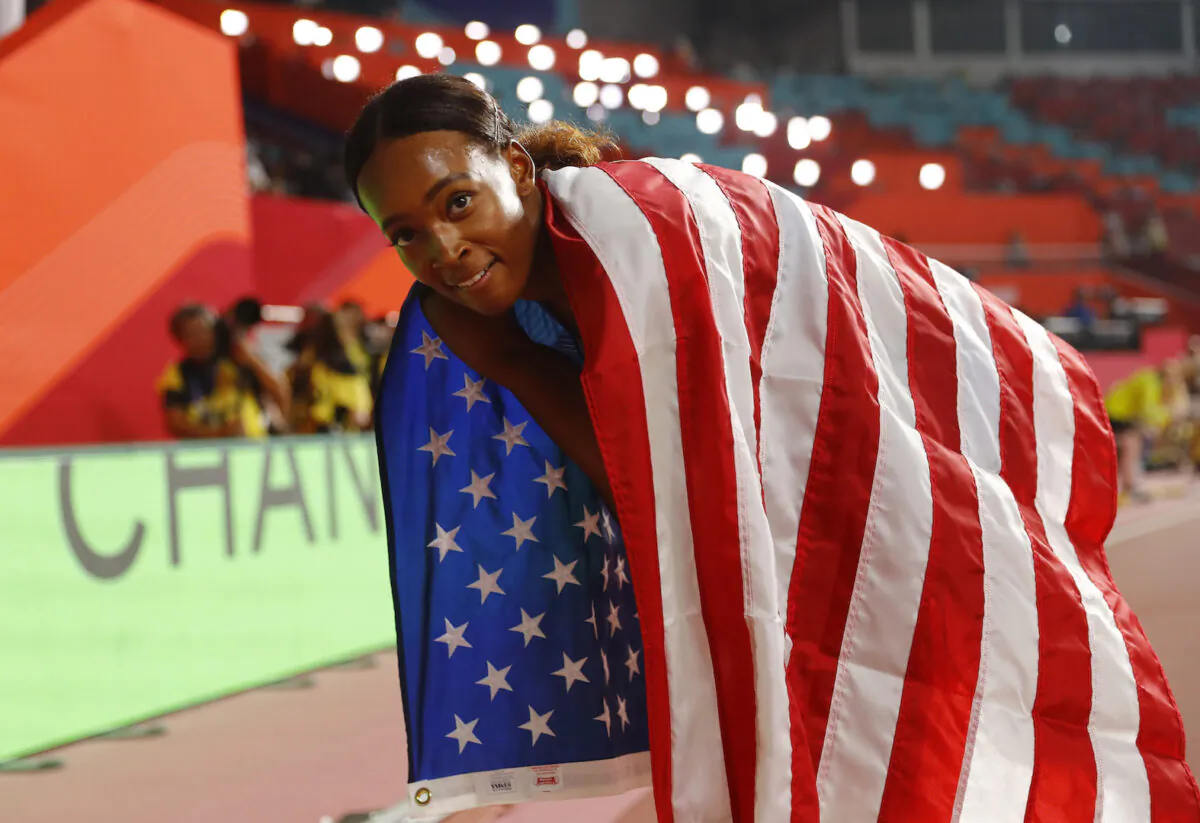 Dalilah Muhammad of the U.S. celebrates after winning gold and breaking the world record at the Khalifa International Stadium, Doha, Qatar on Oct. 4, 2019. (Kai Pfaffenbach/Reuters)