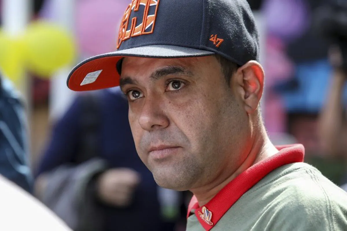 Miguel Perez Jr. listens to a supporter speaking at a news conference in Chicago on Sept. 24, 2019. (Teresa Crawford/AP Photo)