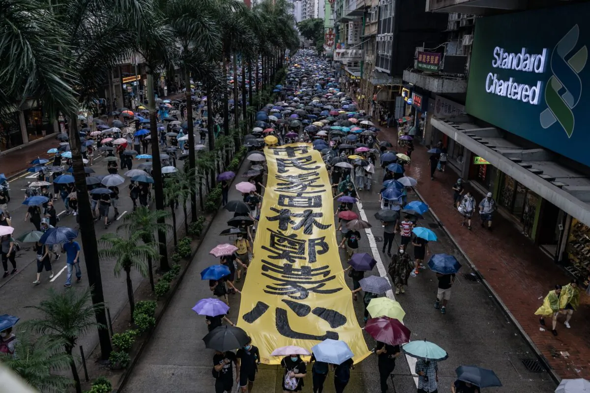 Pro-democracy protesters take part in a demonstration as they march on a street in Hong Kong, China on Oct. 6, 2019. (Anthony Kwan/Getty Images)