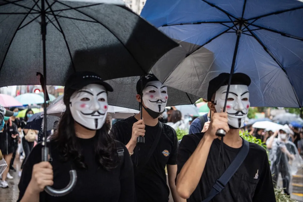 Hong Kong protesters march against a ban on masks in Kowloon in Hong Kong, China, on Oct. 6, 2019. (Laurel Chor/Getty Images)
