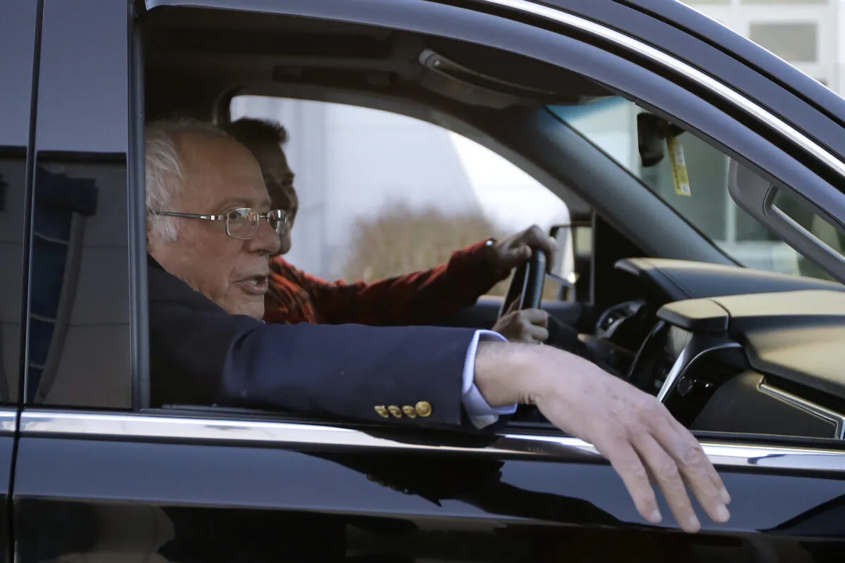 Democratic presidential candidate Sen. Bernie Sanders (I-Vt.) departs Burlington International Airport and head home after being treated for a heart attack, on Oct. 5, 2019. (Steven Senne/AP Photo)