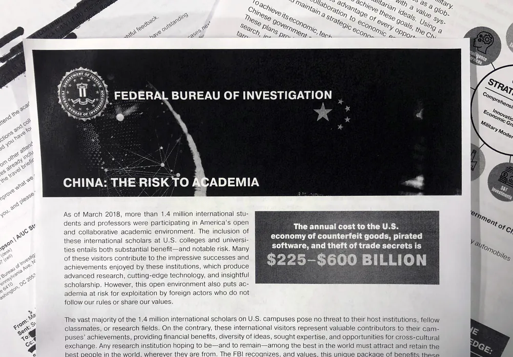 This Oct. 4, 2019, photo shows a copy of an FBI pamphlet and related emails. (AP Photo)