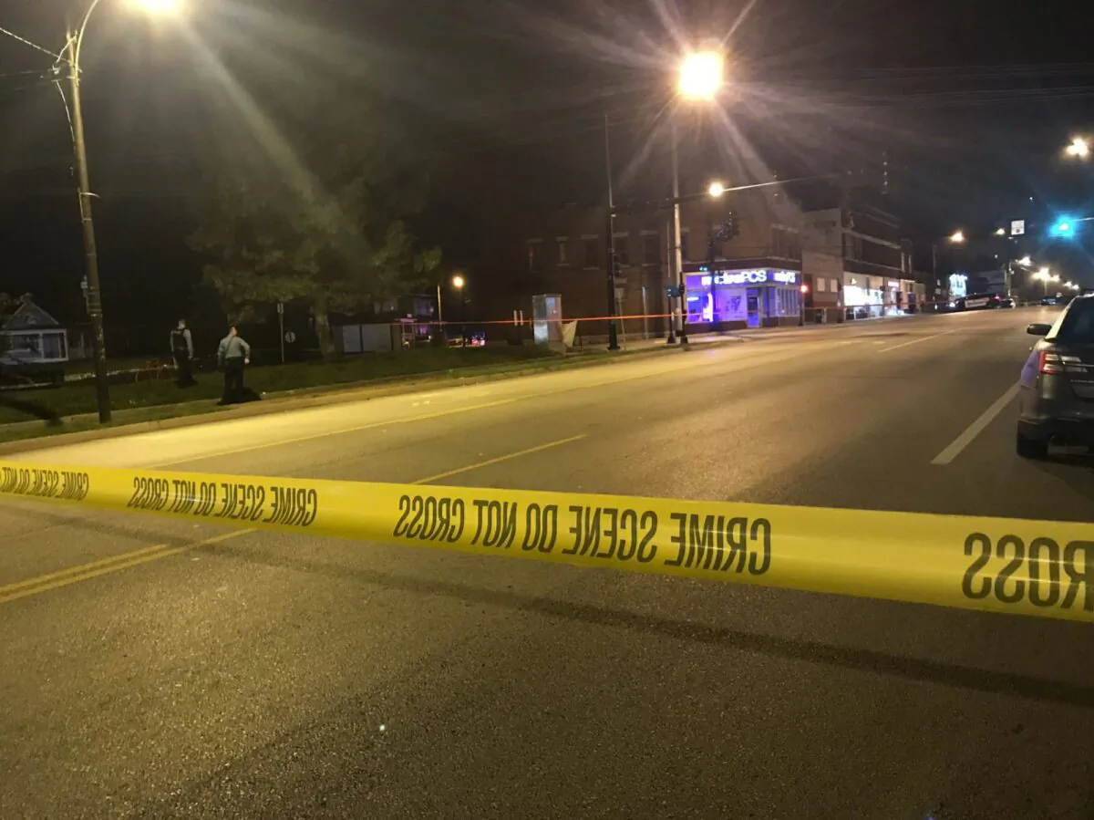 Police work the scene of a shooting outside a Kansas City, Kansas bar, on Oct. 6, 2019. (41 KSHB Kansas City Action News via AP)