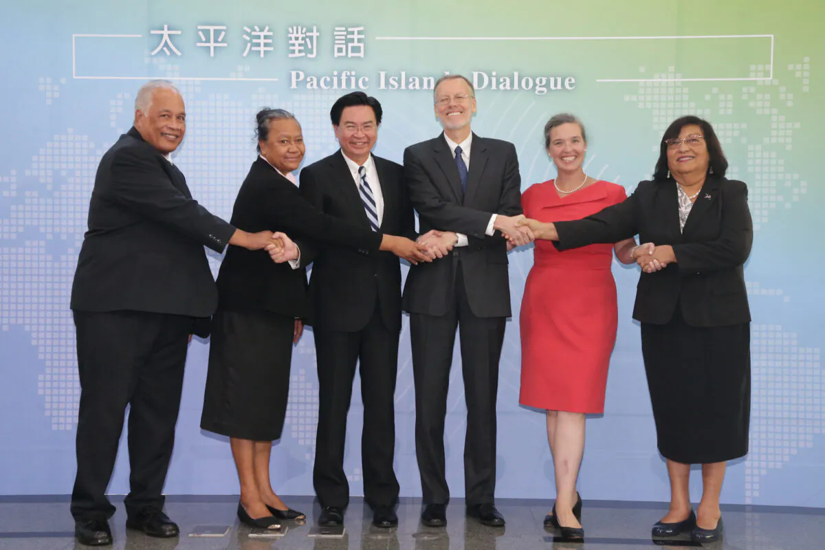 (L-R) Jarden Kephas, Nauru’s ambassador to Taiwan; Limasene Teatu, Tuvalu's ambassador to Taiwan; Taiwan’s foreign minister Joseph Wu; AIT Director W. Brent Christensen; Sandra Oudkirk, State Department's Deputy Assistant Secretary for Australia, New Zealand, and the Pacific Island; and Neijon Rema Edwards, the Marshall Islands’ ambassador to Taiwan, take a group photo at the Pacific Islands Dialogue in Taipei, Taiwan, on Oct. 7, 2019. (Taiwan’s Ministry of Foreign Affairs)