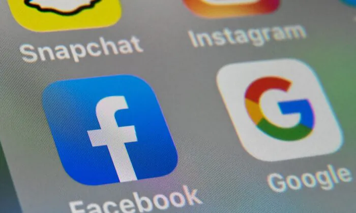 The logos of mobile apps Facebook and Google on a tablet in Lille, France, on Oct. 1, 2019. (Denis Charlet/AFP/Getty Images)