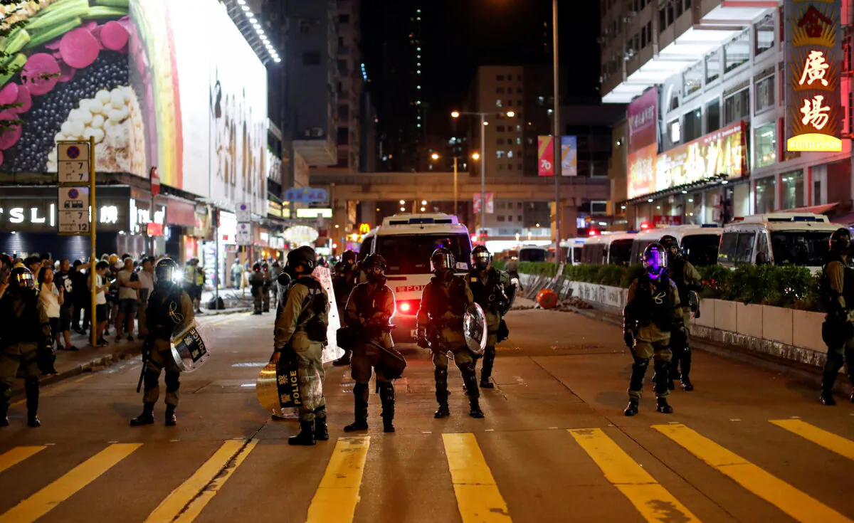 Riot police officers patrol streets as pro-democracy protesters gather in Mong Kok district, Hong Kong, China on Oct. 7, 2019. (Jorge Silva/Reuters)