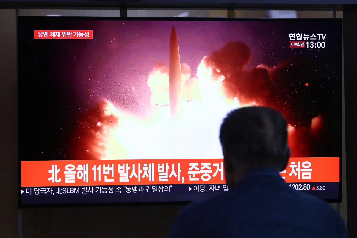 People watch a TV showing a file image of a North Korean missile launch at the Seoul Railway Station on Oct. 2, 2019 in Seoul, South Korea. North Korea fired what was believed to be a submarine-launched ballistic missile (SLBM) from waters off its east coast, South Korea's military said, demonstrating its nuclear delivery capabilities just days before resuming denuclearization talks with the United States. (Chung Sung-Jun/Getty Images)