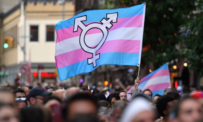 A person holds a transgender pride flag in New York on June 28, 2019. (Angela Weiss/AFP/Getty Images)