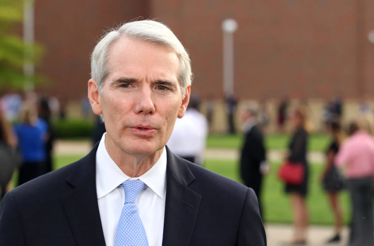 Senator Rob Portman (R-Ohio) speaks to reporters outside Wyoming High School in Wyoming, Ohio, on June 22, 2017. (Paul Vernon/AFP/Getty Images)